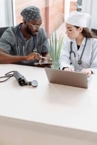 A group of healthcare professionals gathered around a virtual table, discussing and collaborating on personalized care plans for patients.