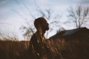 Person practicing mindfulness, symbolizing coping strategies.